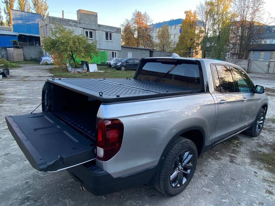 Two-section folding power pickup truck body cover